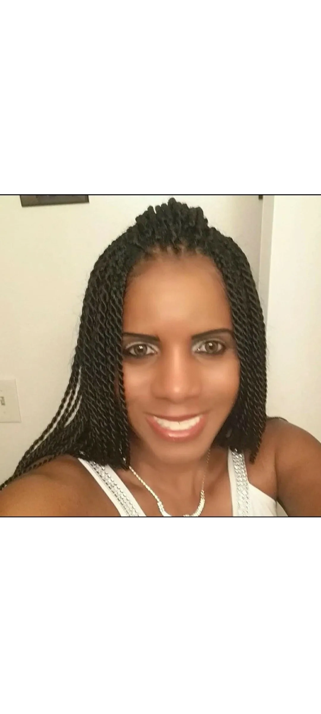 Woman with braided hair smiling portrait