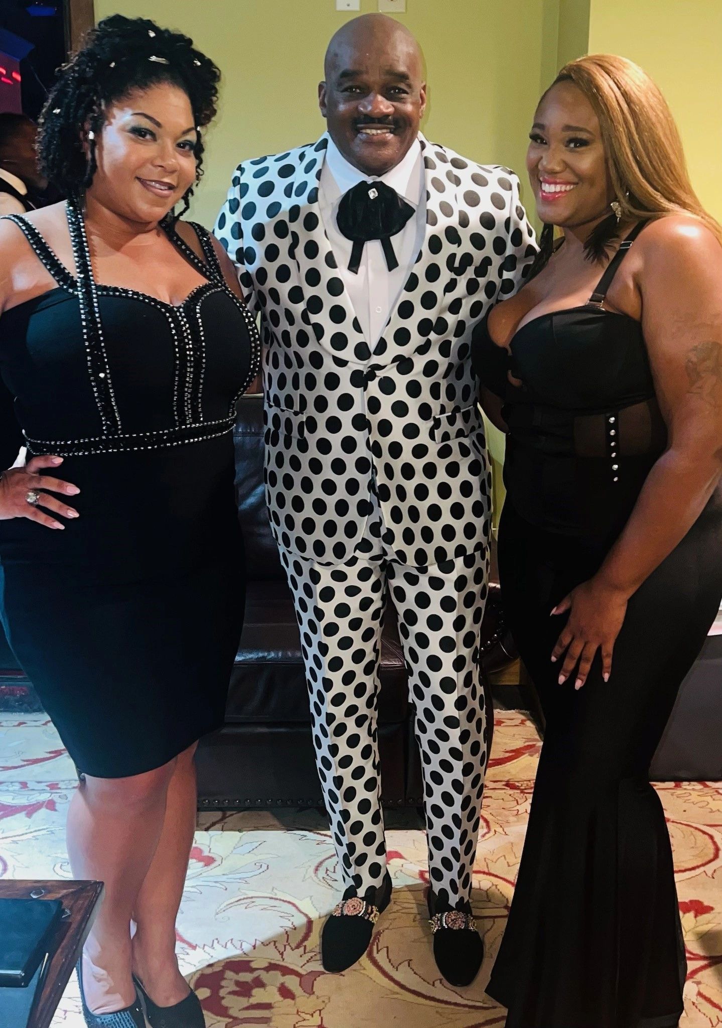 Julius Williams in white polka dot suit at formal event